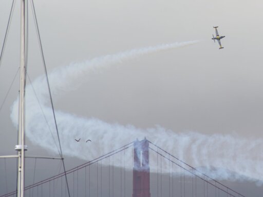 Ace Maker - T-33 doing a fly by and turn with the golden gate bridge in the background